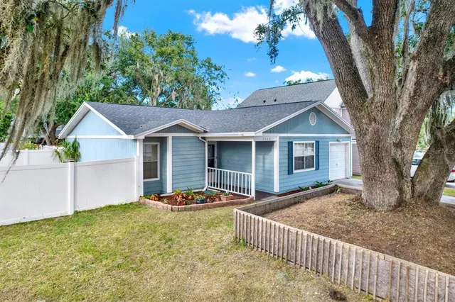 front view of a house with a yard