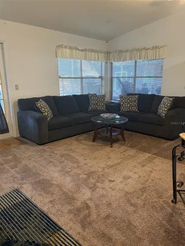 a living room with a couch and a coffee table