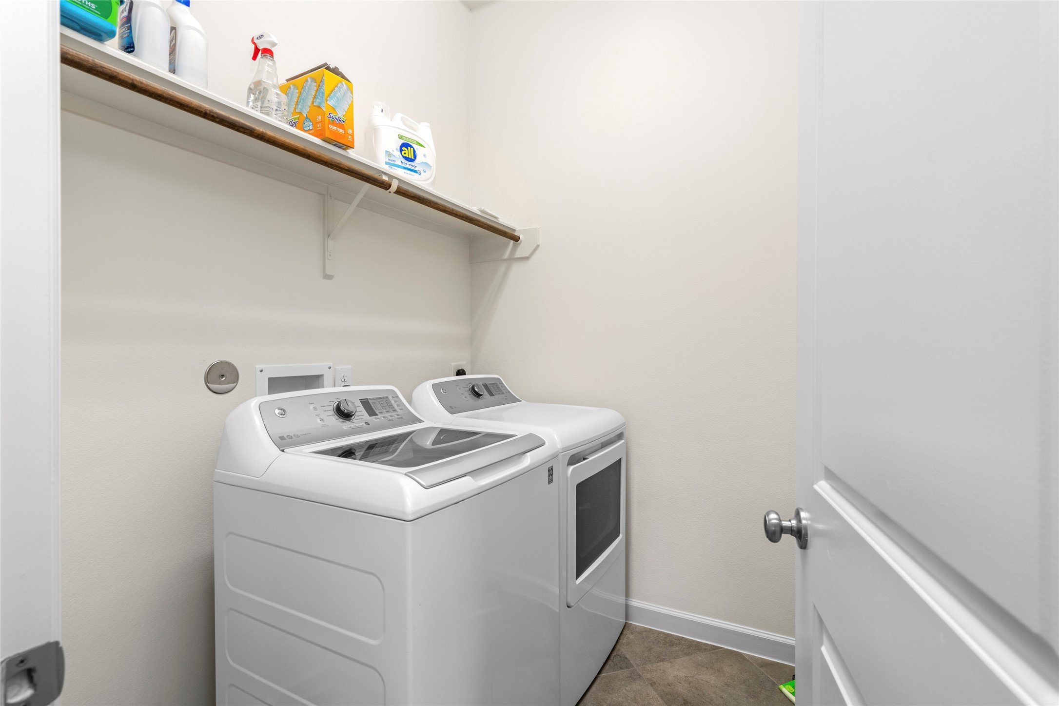 143 Castlegate Lane Houston, TX 77065 - Photo 15 of 33 Laundry room is spacious with room for shelving