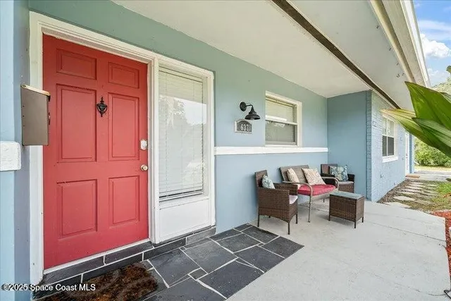 a living room with furniture and a window