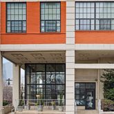 a front view of a building with a door and a bathtub