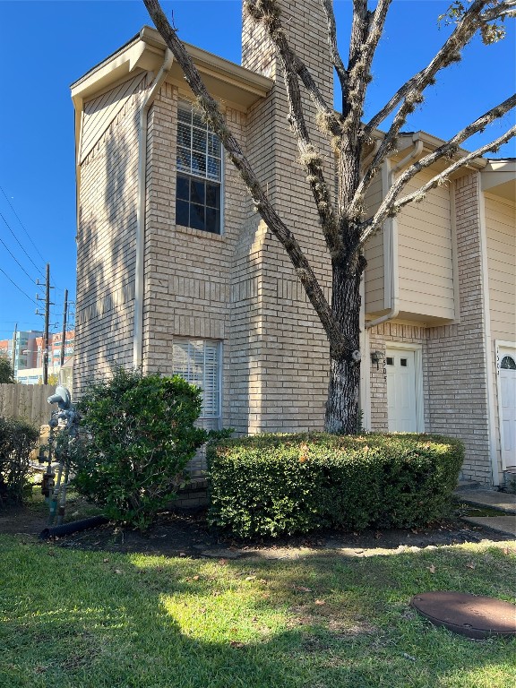 7575 Cambridge Street, Unit 1505 Houston, TX 77054 - Photo 1 of 7 a front view of a house with a yard