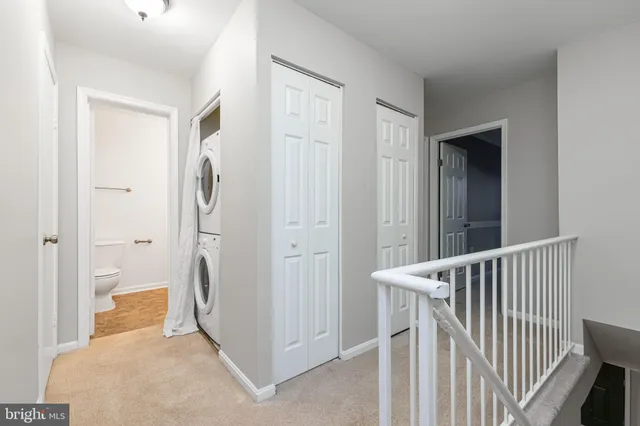 a bathroom with a bath tub with a shower