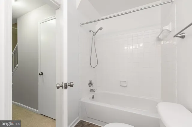 a view of staircase with rug