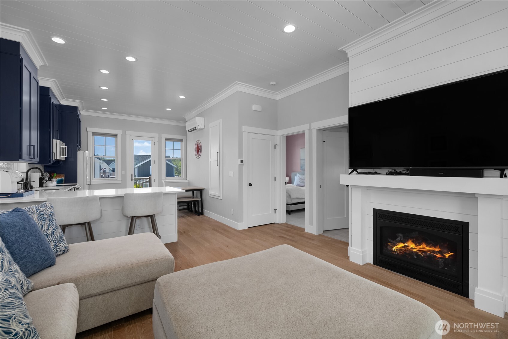 61 Horizon Street Pacific Beach, WA 98571 - Photo 5 of 29 a living room with furniture a flat screen tv and a fireplace