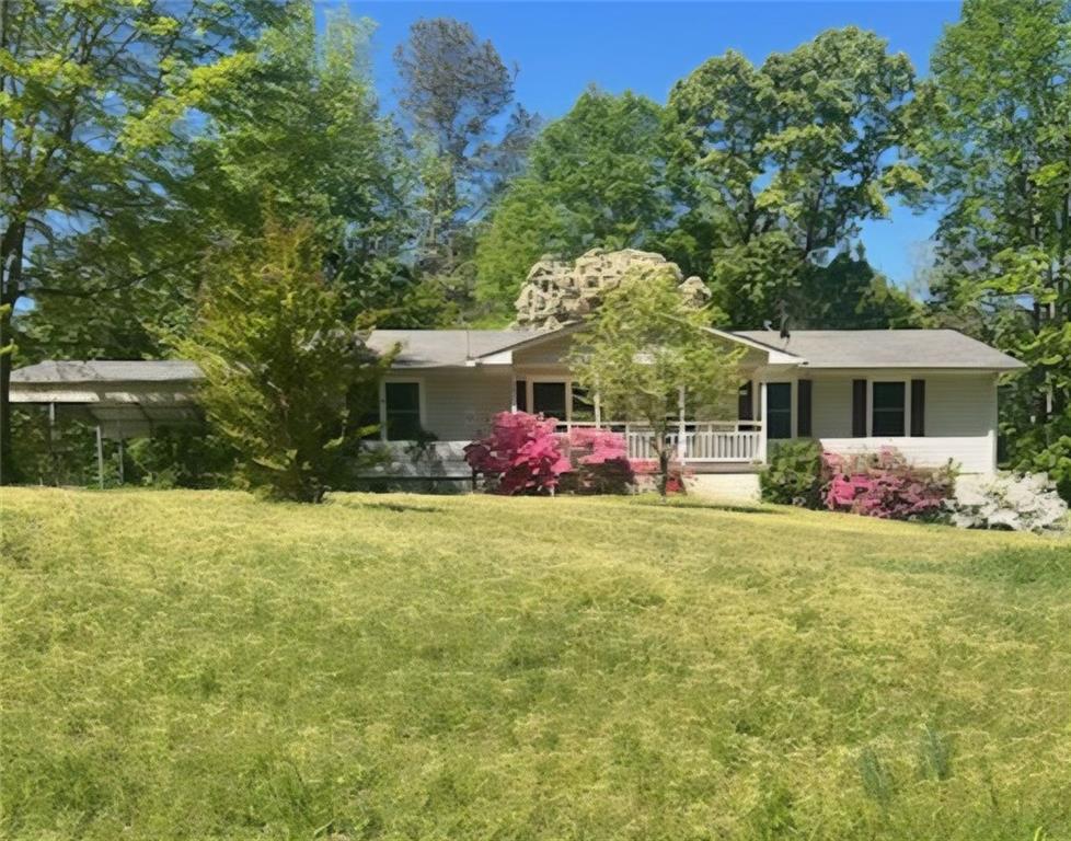 a front view of house with yard and trees