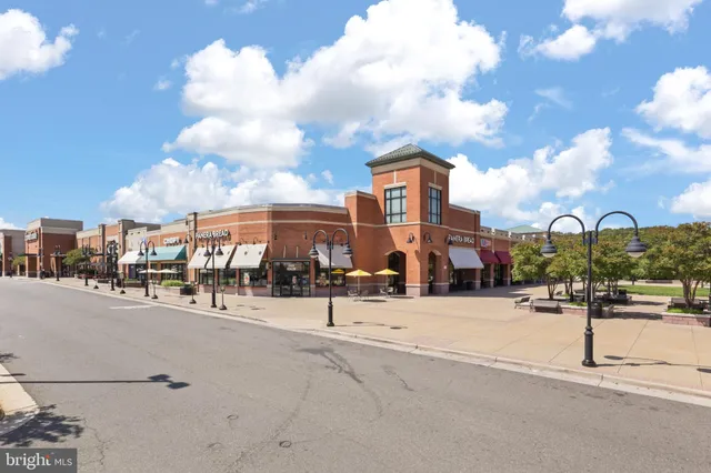 a view of a street with a building in the background