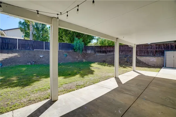 a view of a backyard with a garden and plants