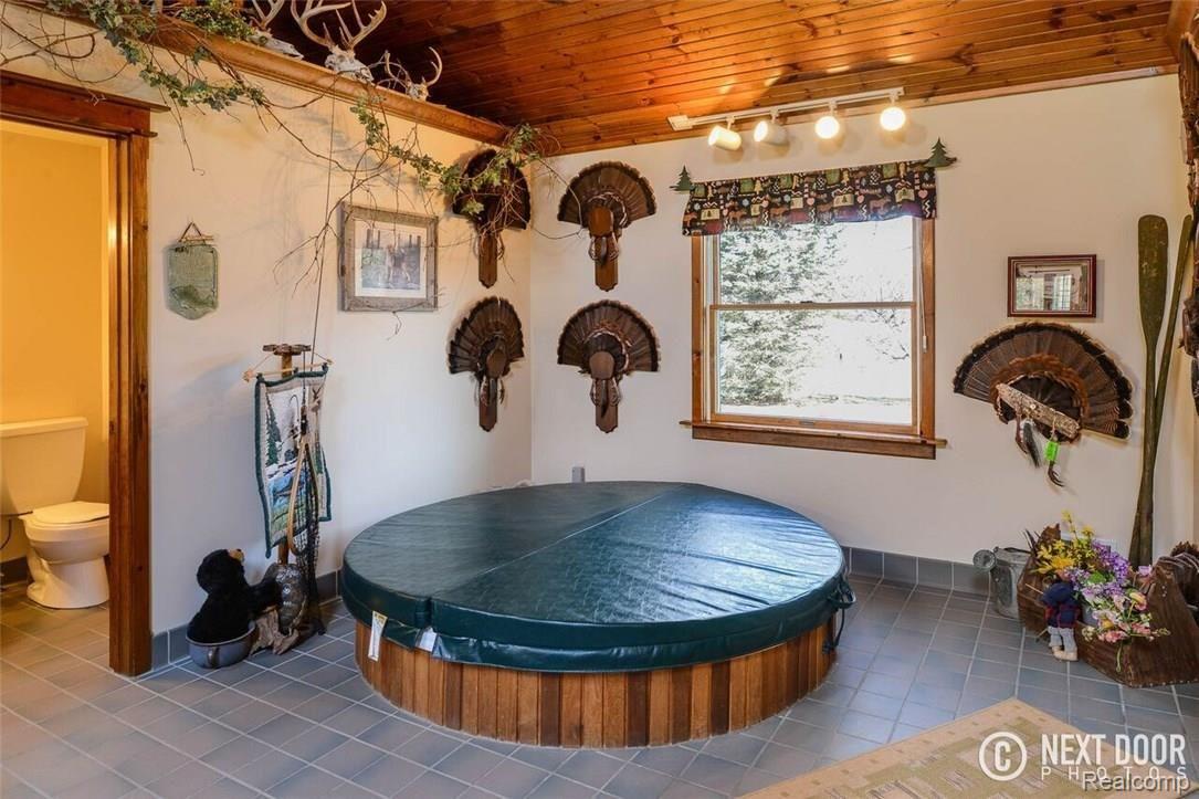 10500 West Allen Road Fowlerville, MI 48836 - Photo 8 of 42 10500 Sunken Hot tub.jpg