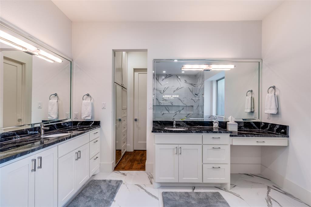 3755 Northview Lane Dallas, TX 75229 - Photo 22 of 36 Another view of the primary bathroom highlighting separate vanities and 2 separate walk in closets with built ins.