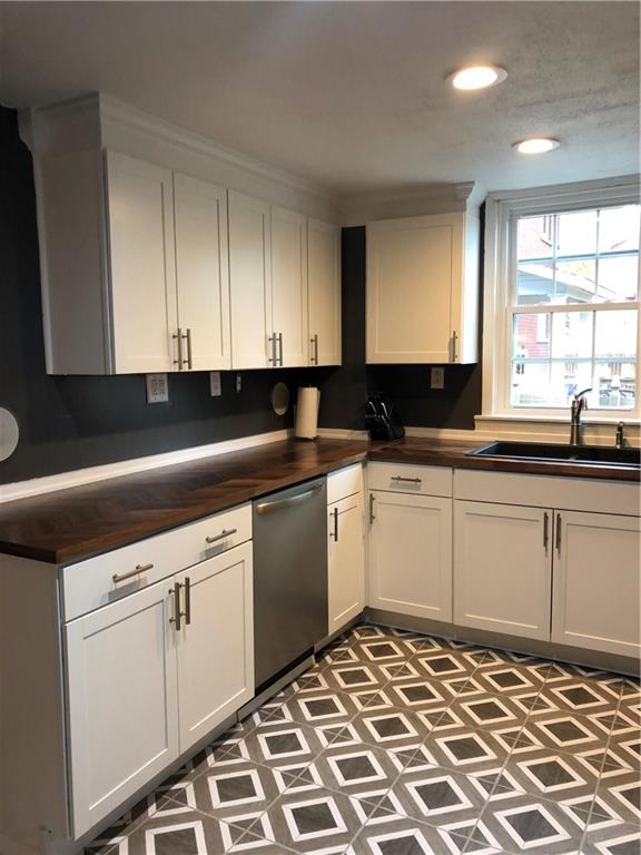 270 Navigation Street Beaver, PA 15009 - Photo 3 of 25 New cupbards, flooring, countertop, sink & appliances await the person who loves being in the kitchen.