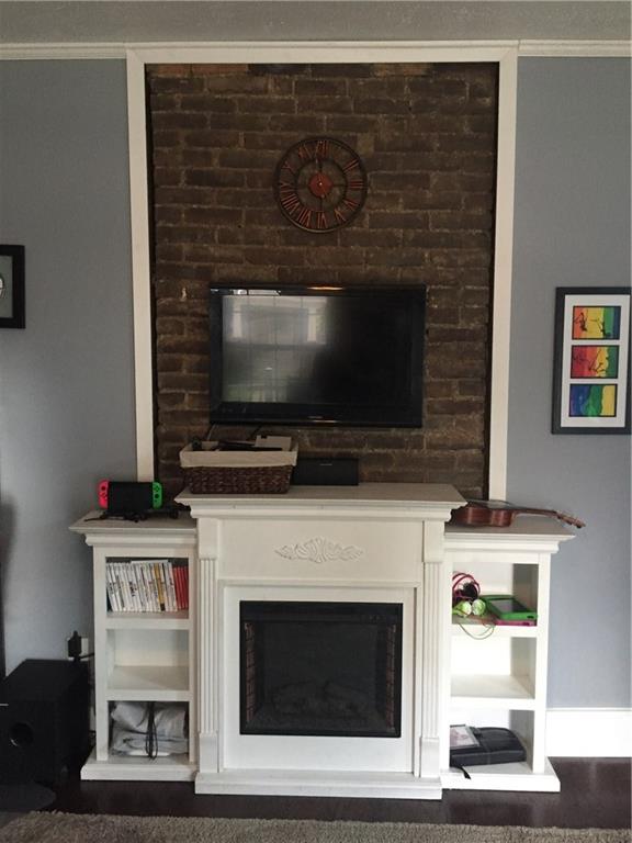 270 Navigation Street Beaver, PA 15009 - Photo 9 of 25 Built in decorative fireplace & original exposed brick work.