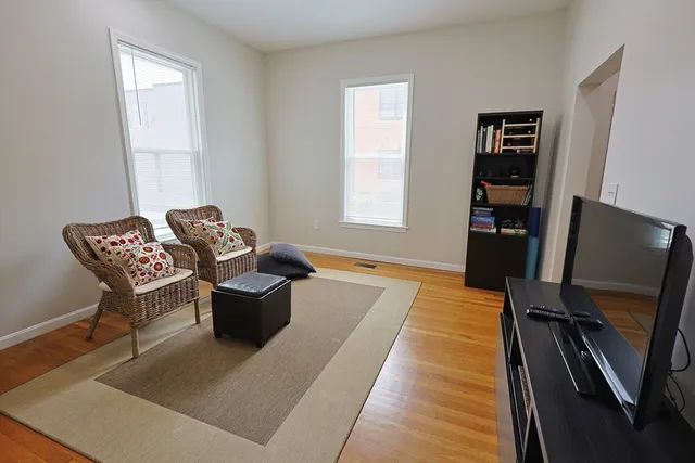 a bedroom with a bed and a book shelf