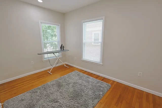 a bathroom with a tub shower and vanity