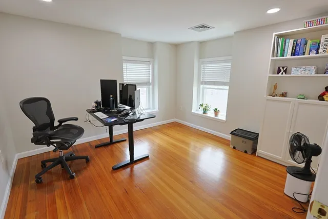 a bathroom with a sink a mirror and toilet