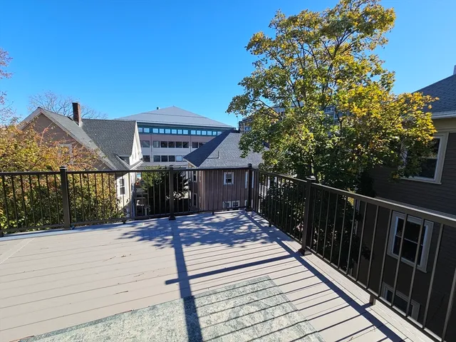 a view of a chairs and table in backyard