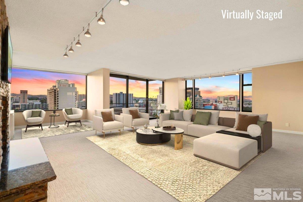 a living room with furniture and a large window