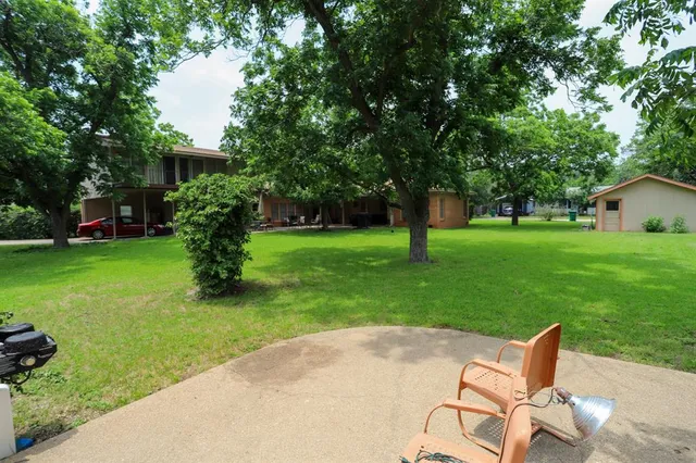 a garden view with a fountain