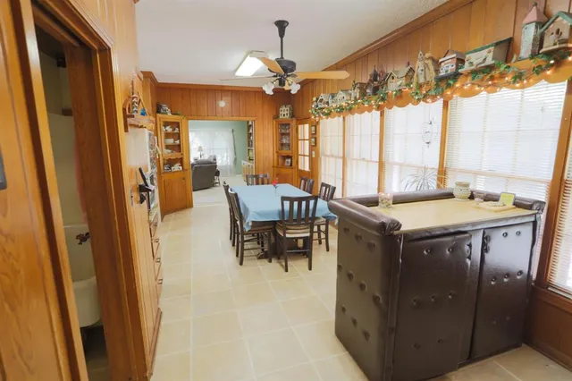 a very nice looking dining room with a large window