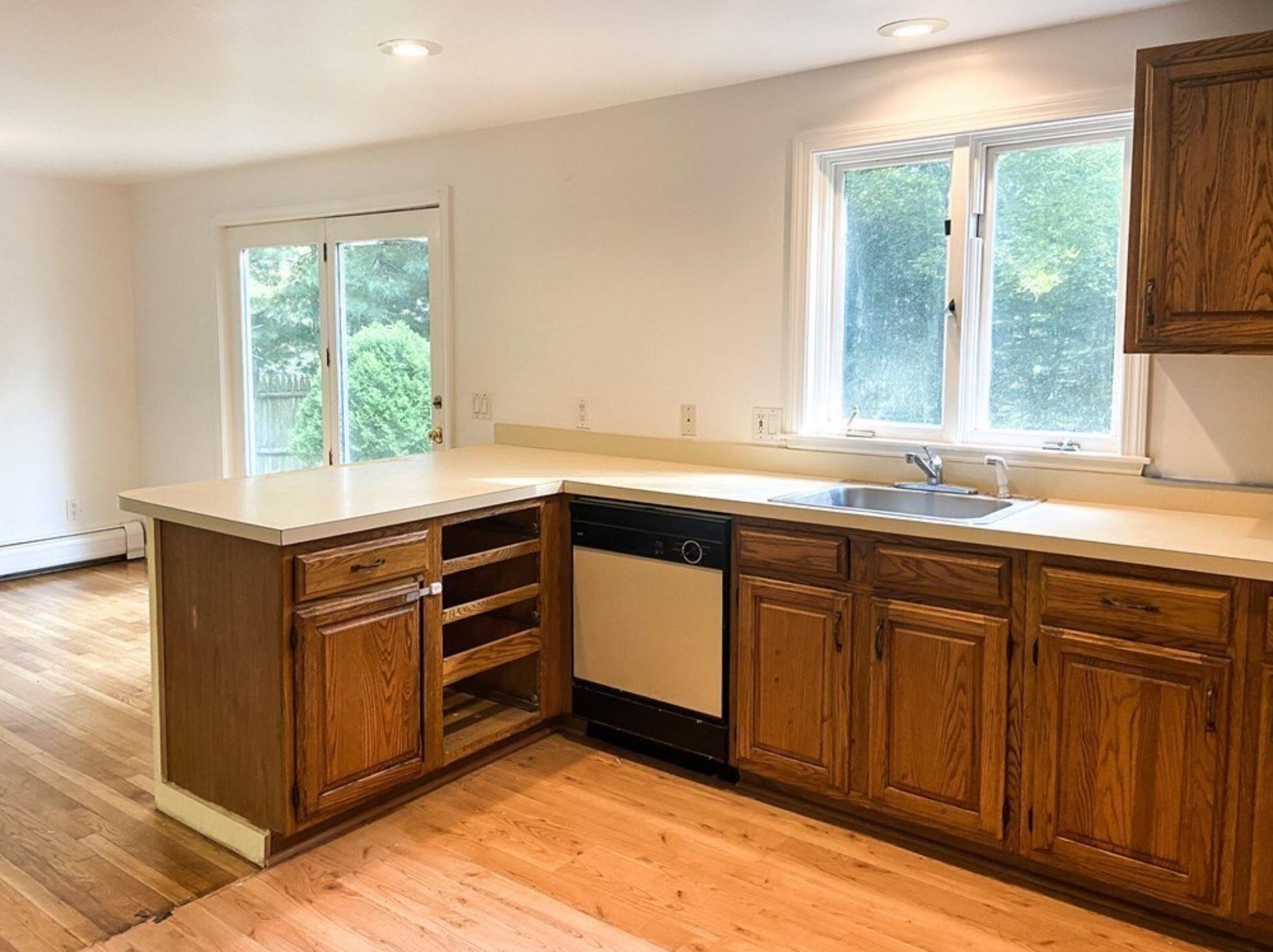 577 Lumbert Mill Road Osterville, MA 02655 - Photo 14 of 22 a kitchen with stainless steel appliances granite countertop a sink and a window