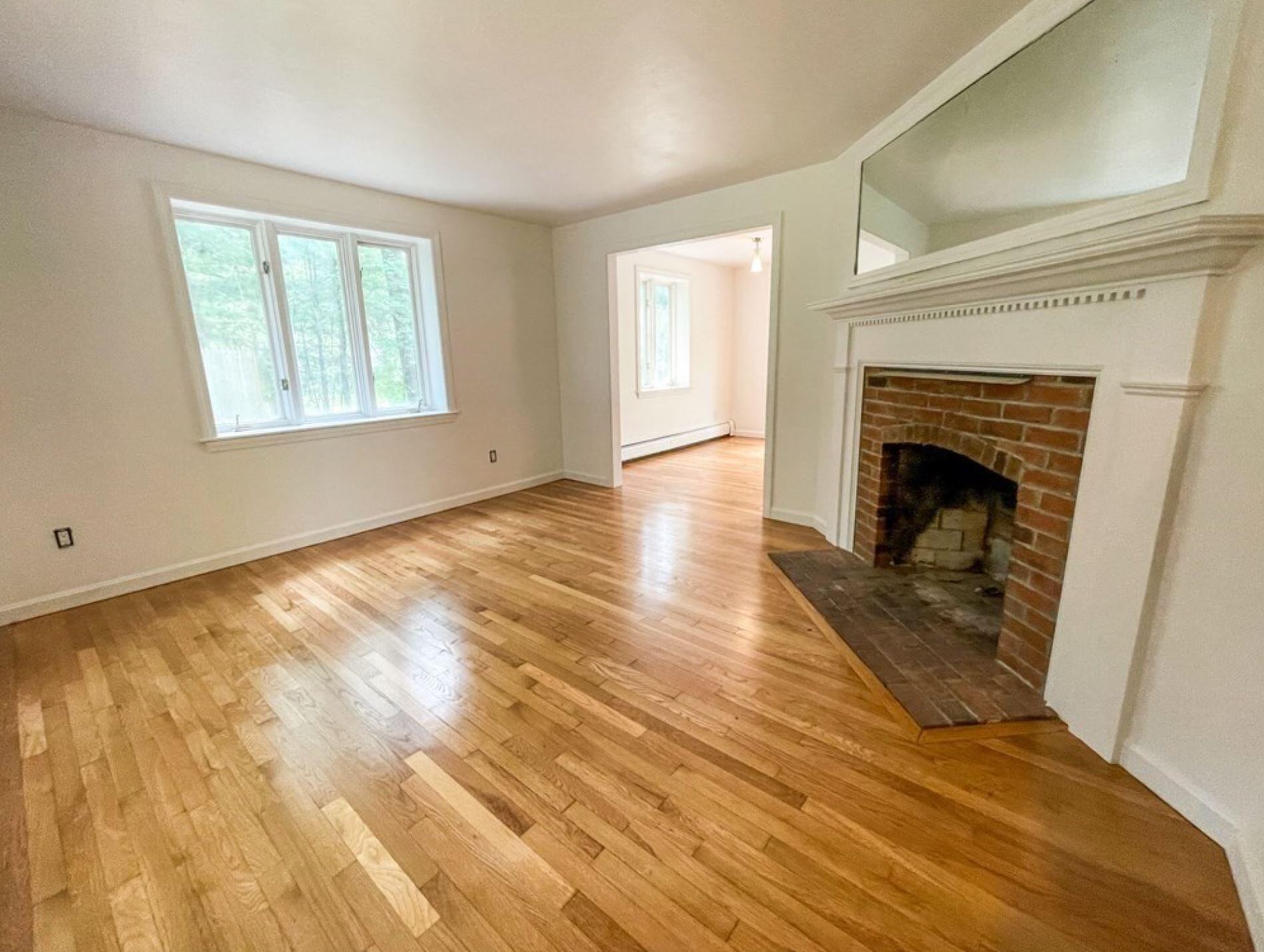 577 Lumbert Mill Road Osterville, MA 02655 - Photo 16 of 22 a view of an empty room with wooden floor and a window