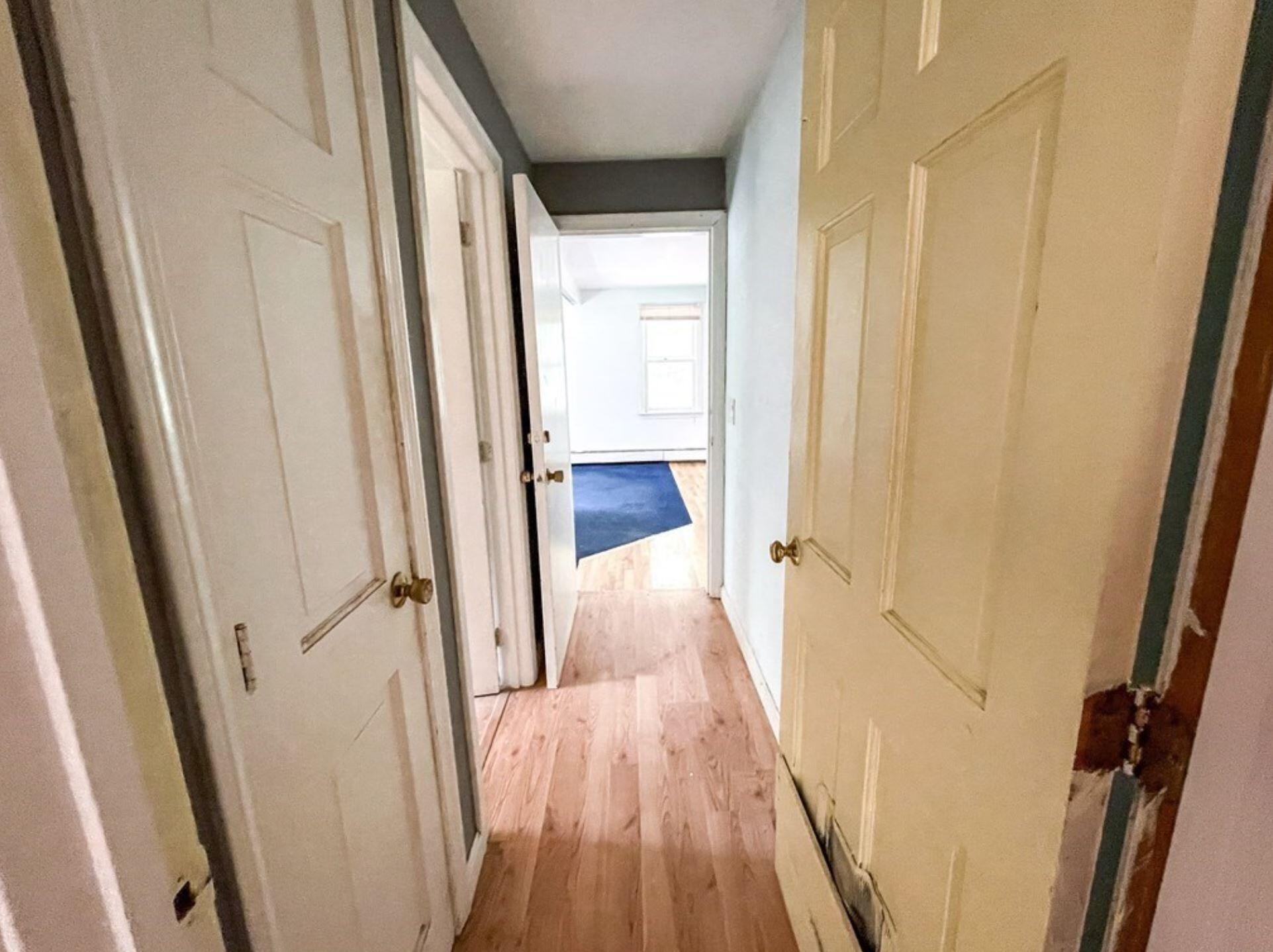577 Lumbert Mill Road Osterville, MA 02655 - Photo 19 of 22 a view of a hallway with wooden floor and staircase