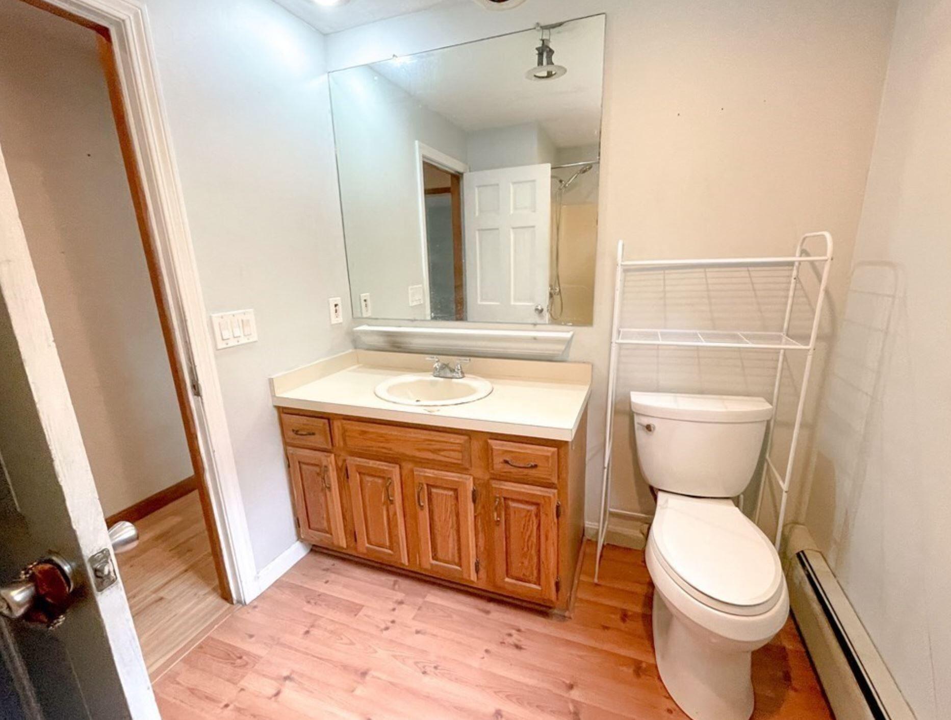 577 Lumbert Mill Road Osterville, MA 02655 - Photo 22 of 22 a bathroom with a toilet sink and mirror