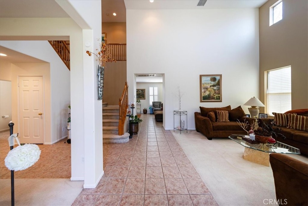 13449 Quail Run Road Eastvale, CA 92880 - Photo 13 of 59 a living room with furniture and a couch