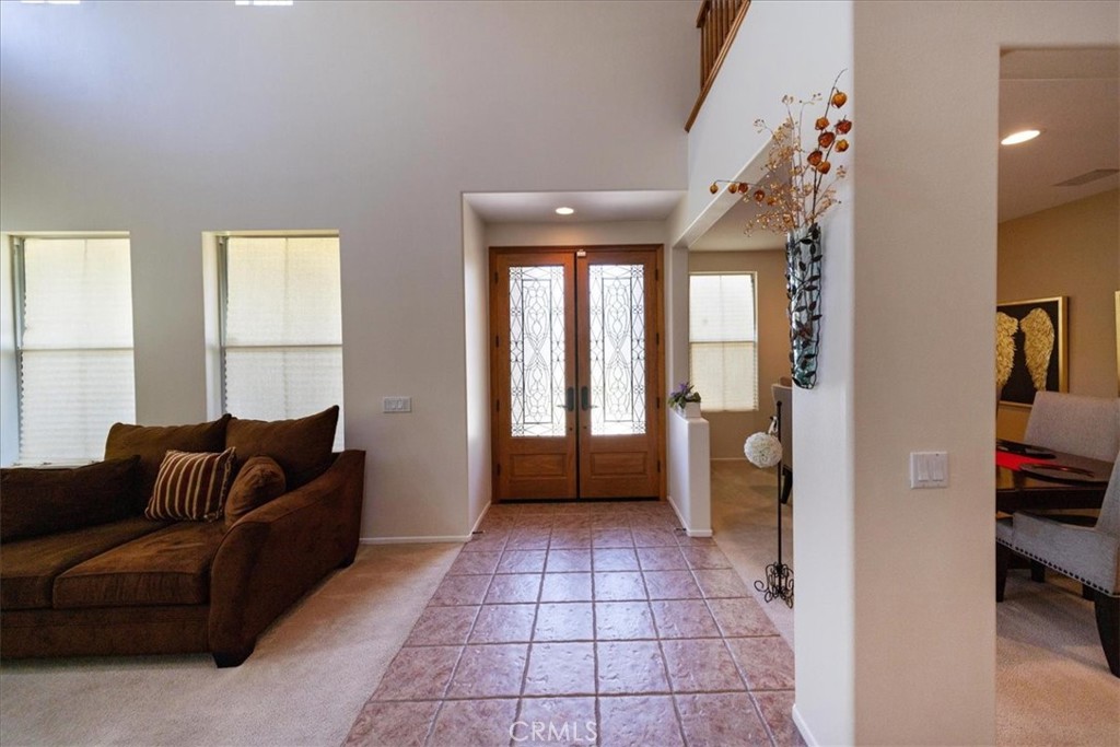 13449 Quail Run Road Eastvale, CA 92880 - Photo 14 of 59 a living room with furniture and a window