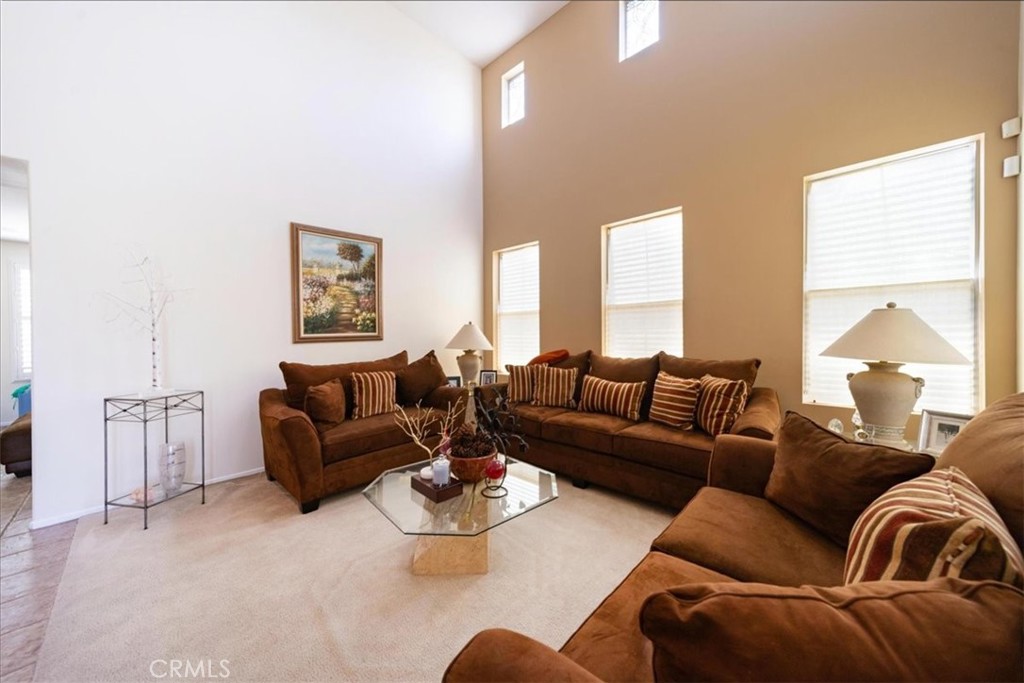 13449 Quail Run Road Eastvale, CA 92880 - Photo 15 of 59 a living room with furniture and a large window