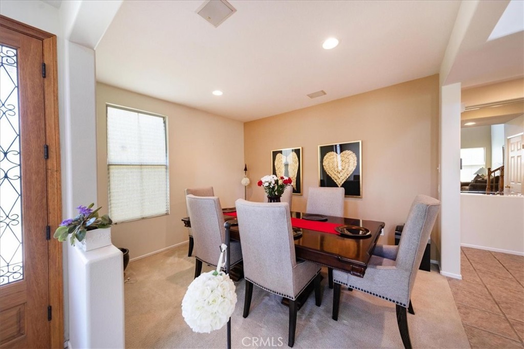 13449 Quail Run Road Eastvale, CA 92880 - Photo 19 of 59 a view of a dining room with furniture window and outside view