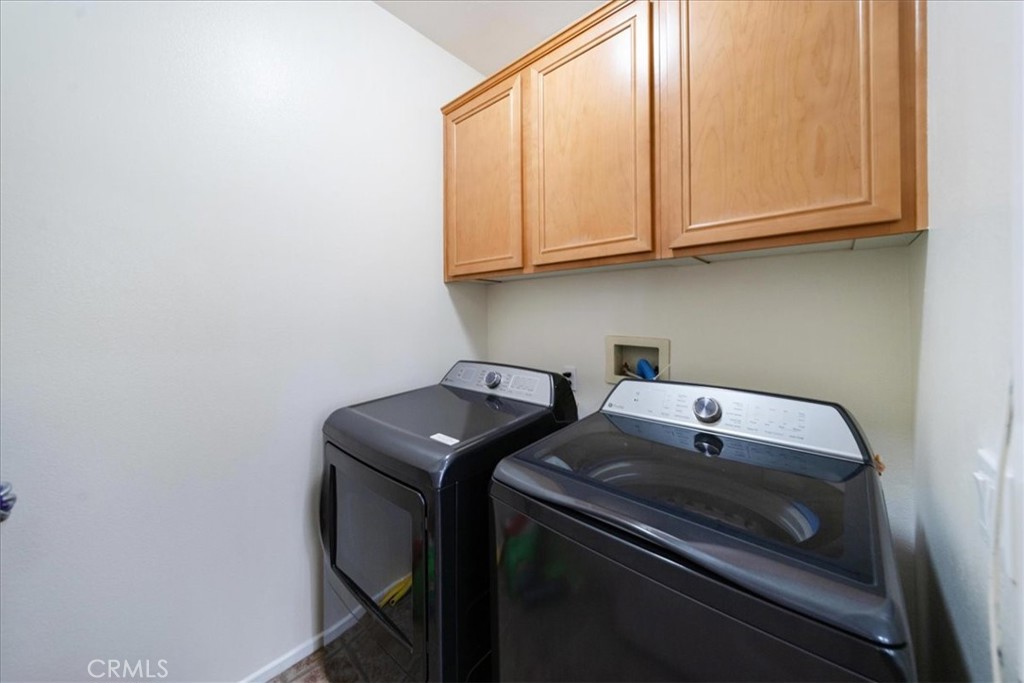 13449 Quail Run Road Eastvale, CA 92880 - Photo 29 of 59 a utility room with dryer and washer