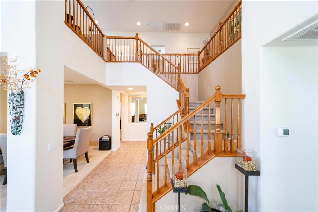 13449 Quail Run Road Eastvale, CA 92880 - Photo 36 of 59 a view of entryway and hall with wooden floor