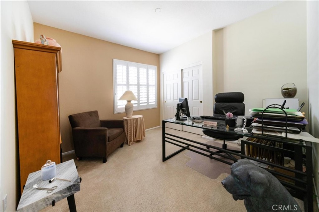 13449 Quail Run Road Eastvale, CA 92880 - Photo 45 of 59 a living room with furniture and a window