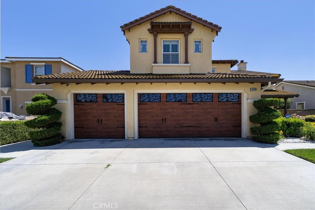 13449 Quail Run Road Eastvale, CA 92880 - Photo 8 of 59 a front view of a building with entryway