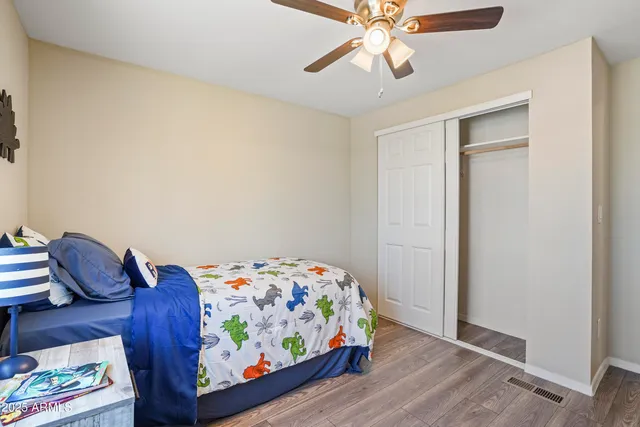 a bedroom with a bed and hallway