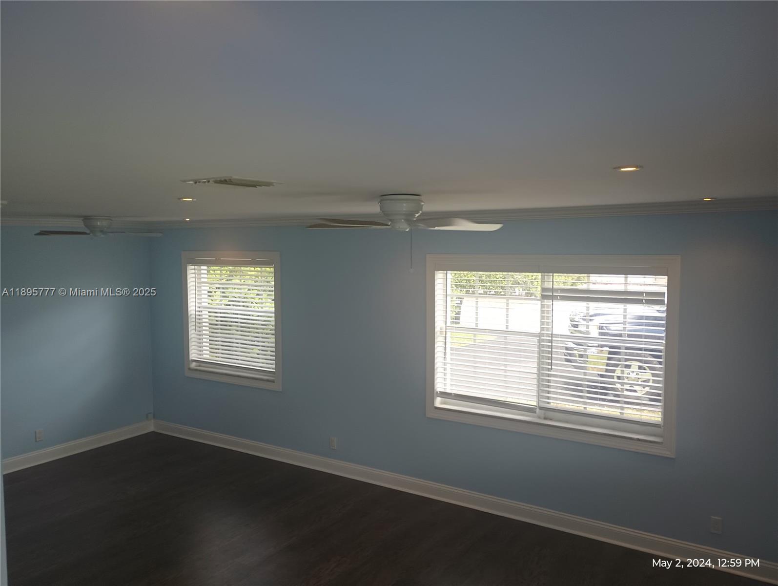 258 Neptune Avenue, Unit N Lauderdale-by-the-Sea, FL 33308 - Photo 13 of 14 a view of an empty room with wooden floor and a window
