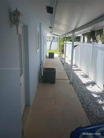 a hallway with a couch and a stove