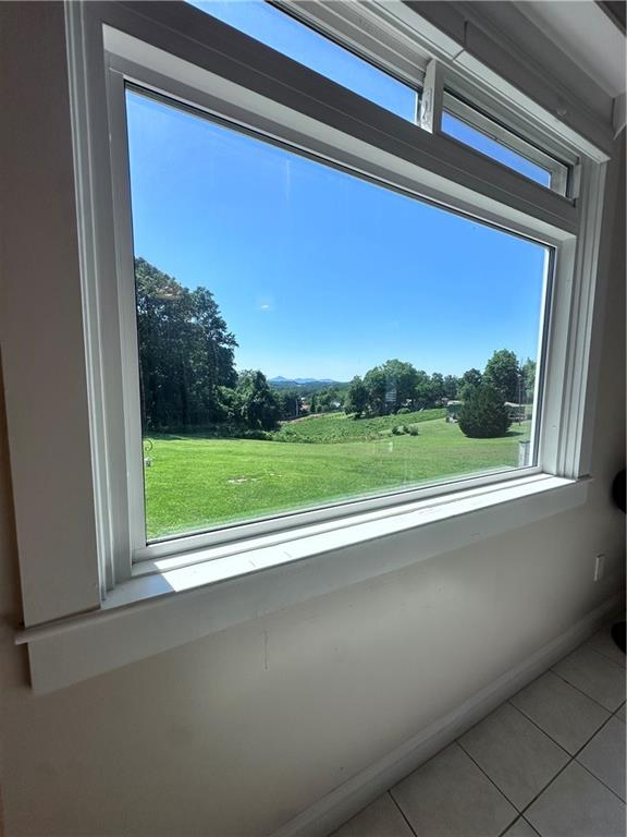 1815 Pickens Street Ball Ground, GA 30107 - Photo 5 of 38 a view of a floor to ceiling window and a yard