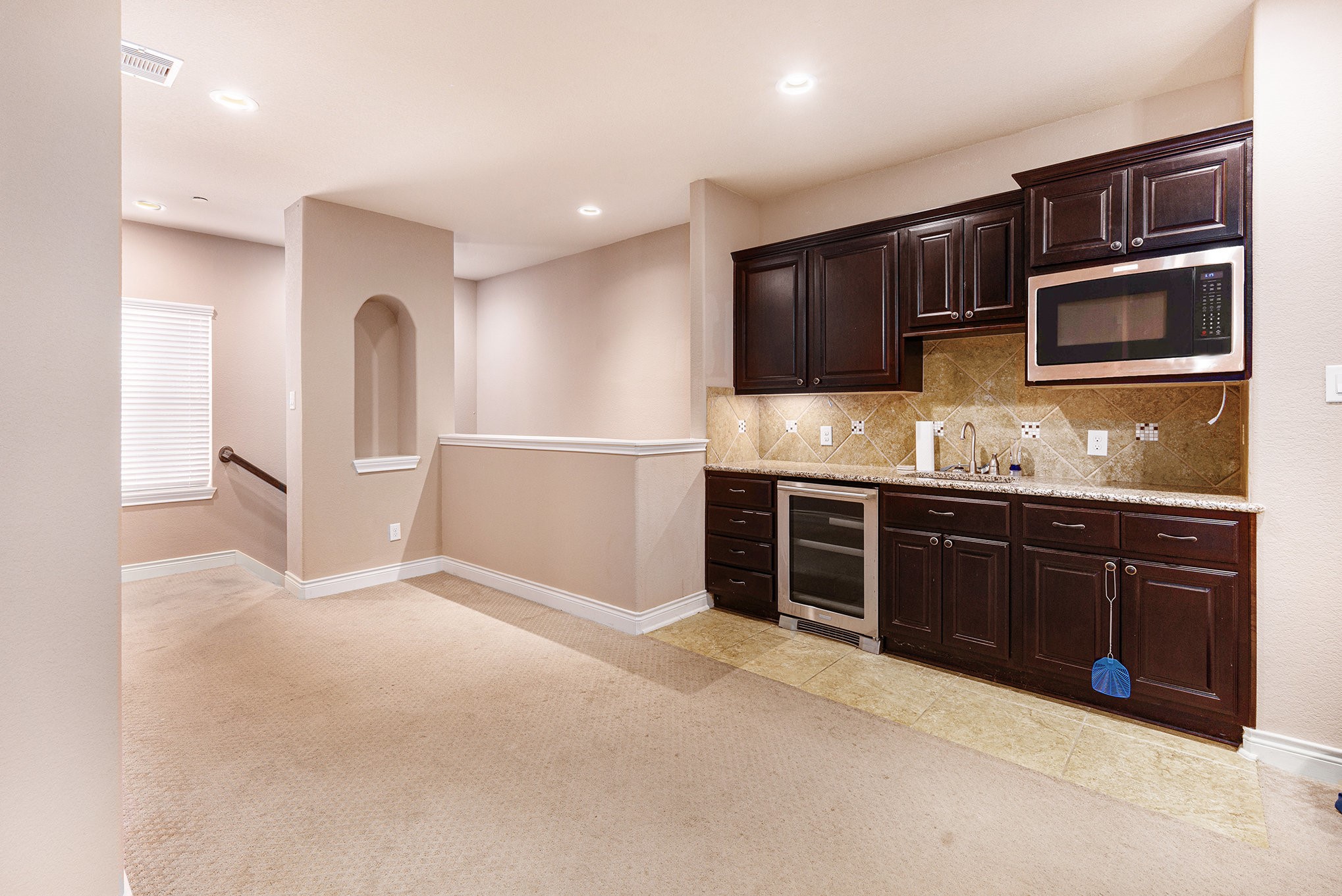 9039 Centennial Drive Conroe, TX 77384 - Photo 9 of 16 a kitchen with stainless steel appliances granite countertop a refrigerator and a stove top oven