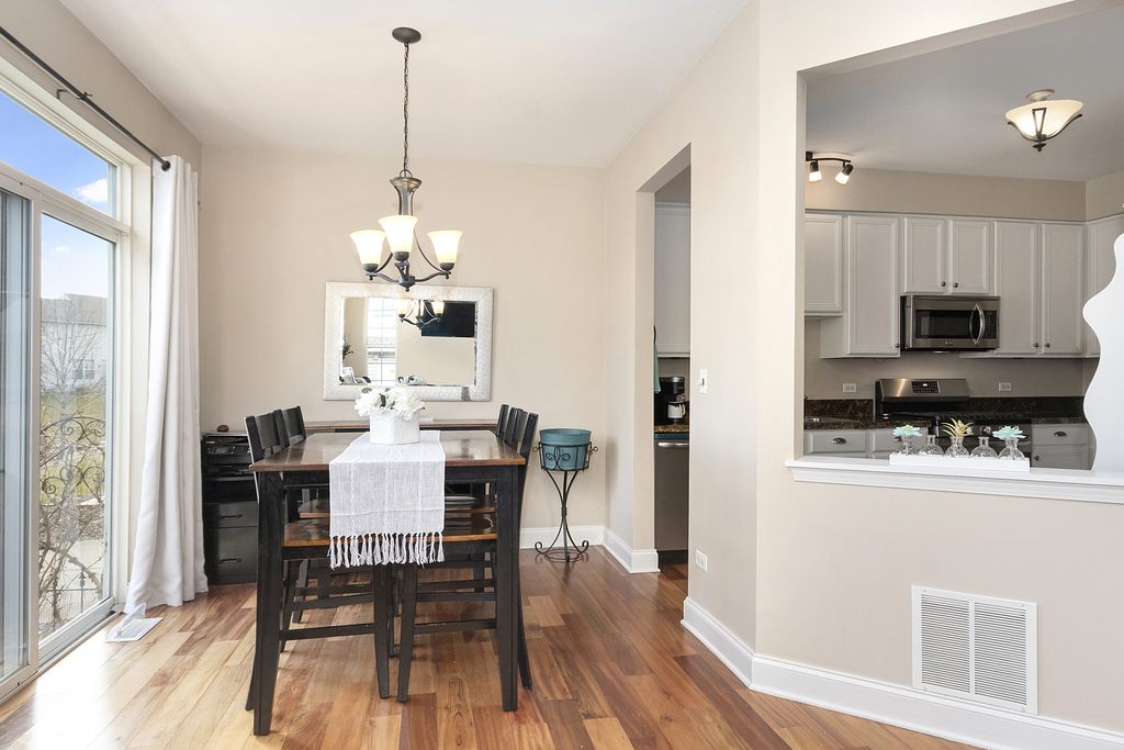 2935 Gypsum Circle Naperville, IL 60564 - Photo 11 of 34 a view of a dining room with furniture window and wooden floor