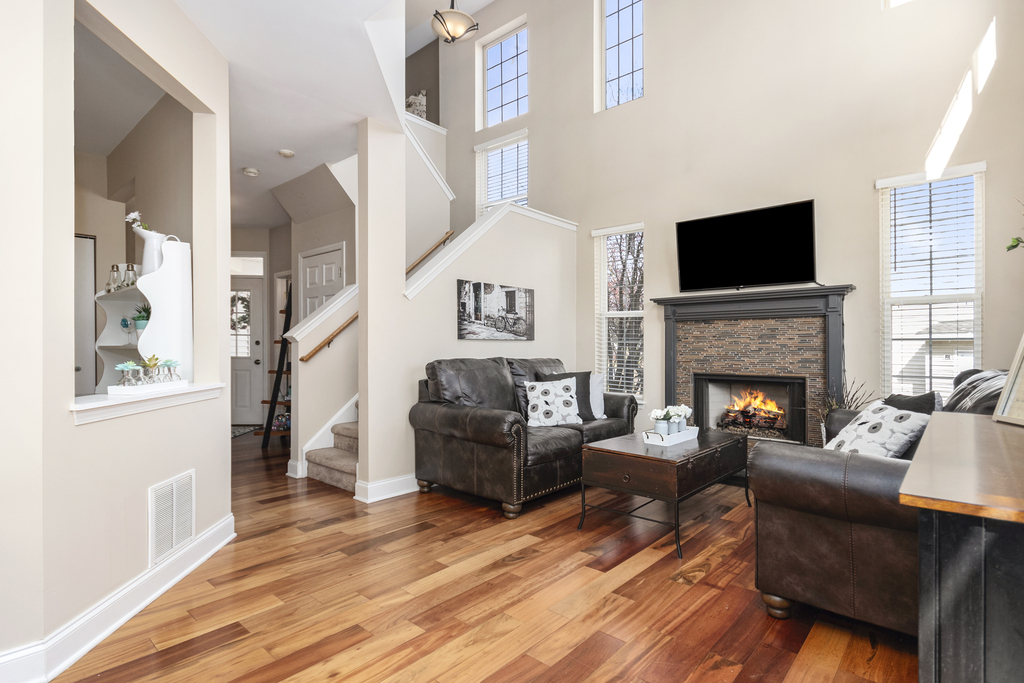 2935 Gypsum Circle Naperville, IL 60564 - Photo 12 of 34 a living room with furniture a flat screen tv and a fireplace