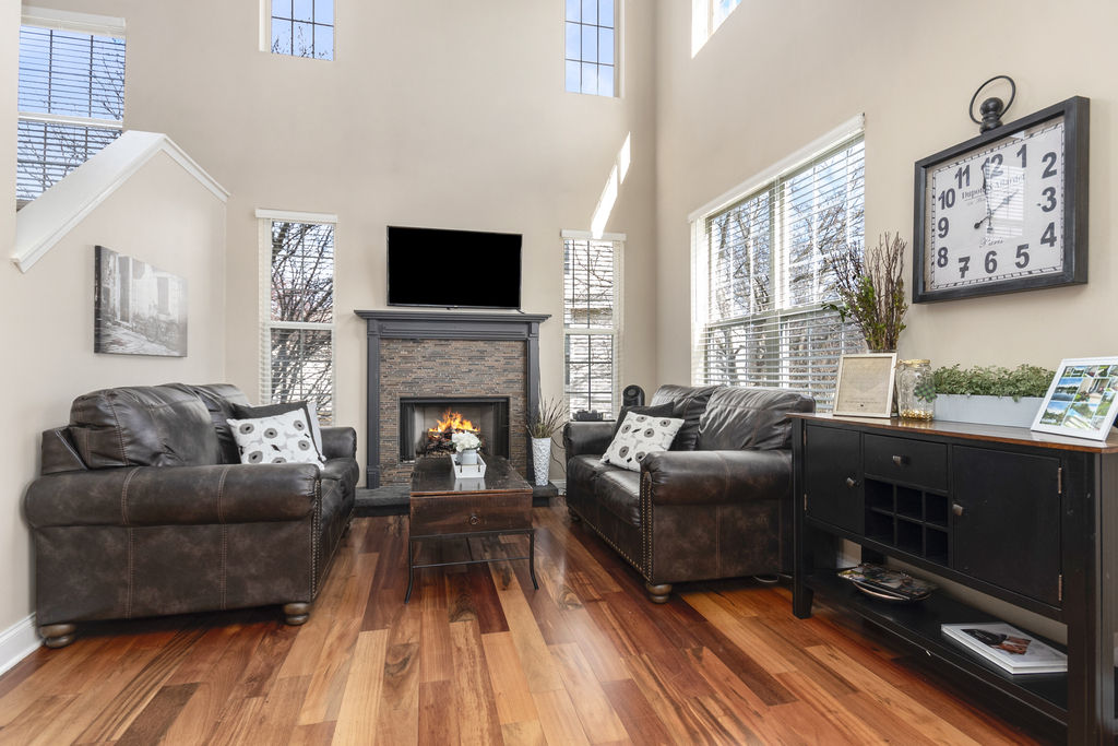 2935 Gypsum Circle Naperville, IL 60564 - Photo 13 of 34 a living room with furniture a flat screen tv and a fireplace