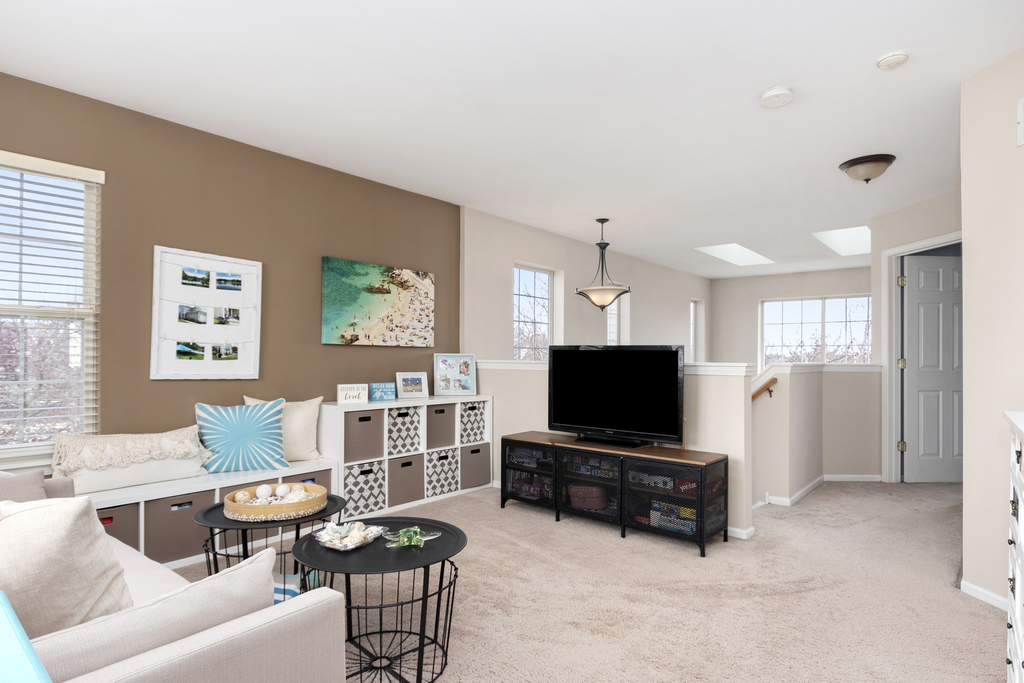 2935 Gypsum Circle Naperville, IL 60564 - Photo 15 of 34 a living room with furniture and a flat screen tv
