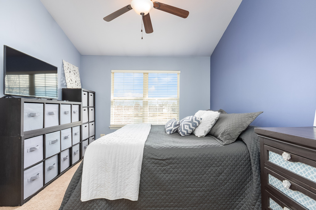 2935 Gypsum Circle Naperville, IL 60564 - Photo 18 of 34 a bedroom with a bed next to a window with the outer view