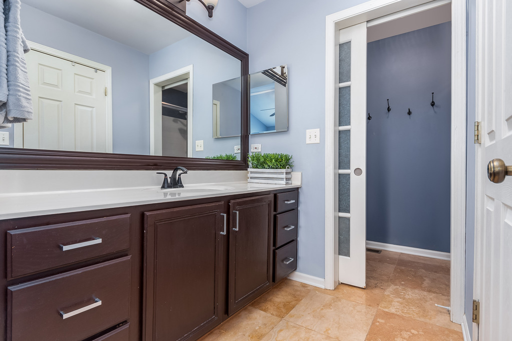 2935 Gypsum Circle Naperville, IL 60564 - Photo 19 of 34 a spacious bathroom with a double vanity sink and a mirror
