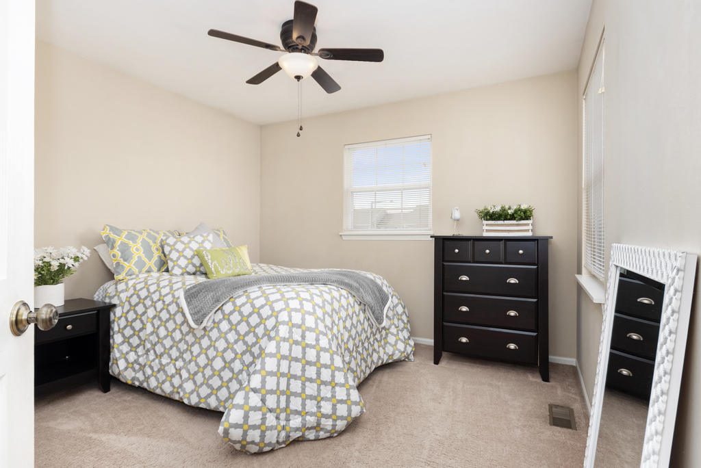 2935 Gypsum Circle Naperville, IL 60564 - Photo 21 of 34 a bedroom with a bed and a dresser