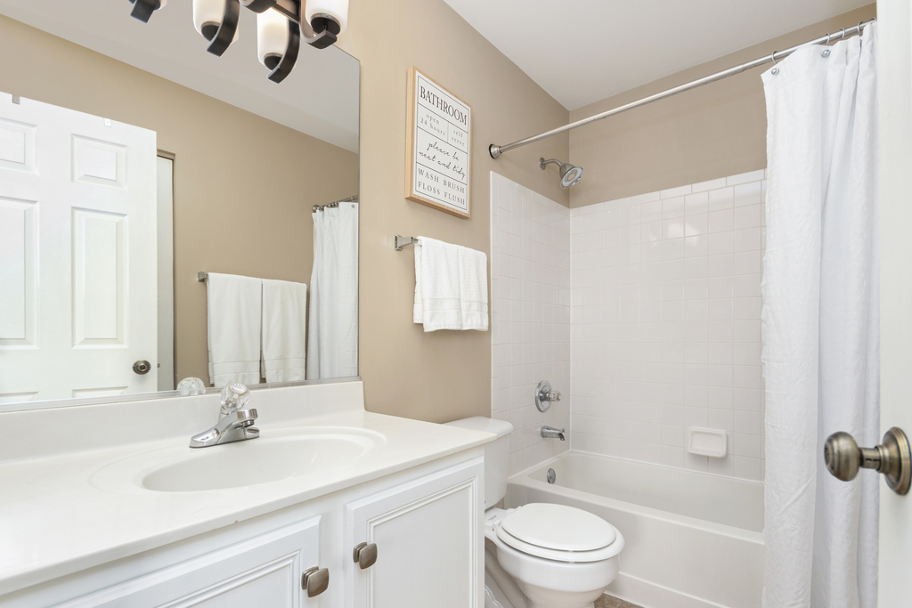 2935 Gypsum Circle Naperville, IL 60564 - Photo 22 of 34 a bathroom with a sink a toilet and a mirror