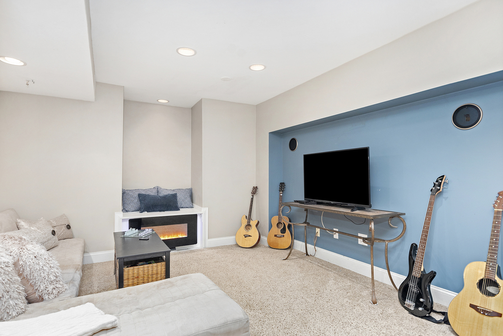 2935 Gypsum Circle Naperville, IL 60564 - Photo 24 of 34 a living room with furniture and a flat screen tv