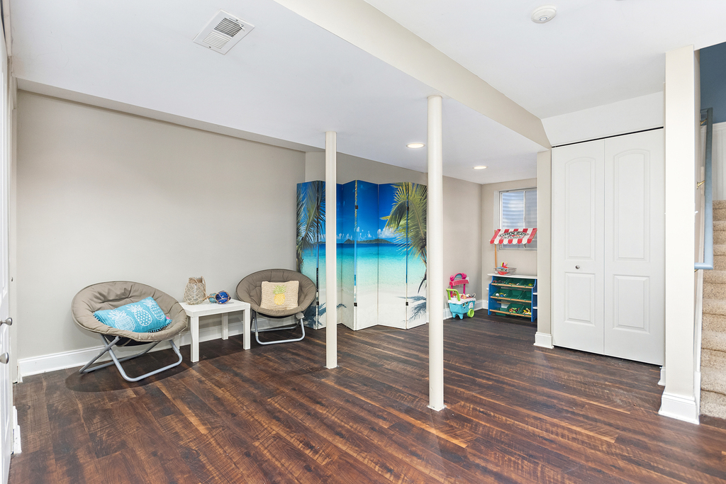 2935 Gypsum Circle Naperville, IL 60564 - Photo 26 of 34 a living room with furniture a wooden floor and a sink